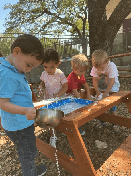 Children playing at a sensory table