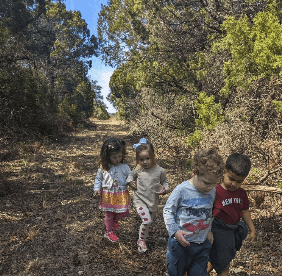 Children walking outdoors on the nature trail